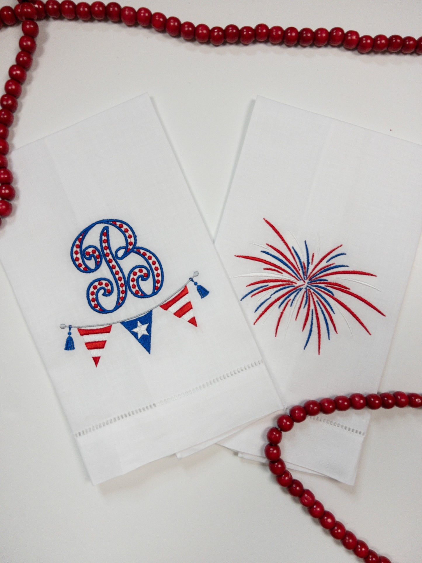 Monogrammed patriotic hand towel and firework towel.