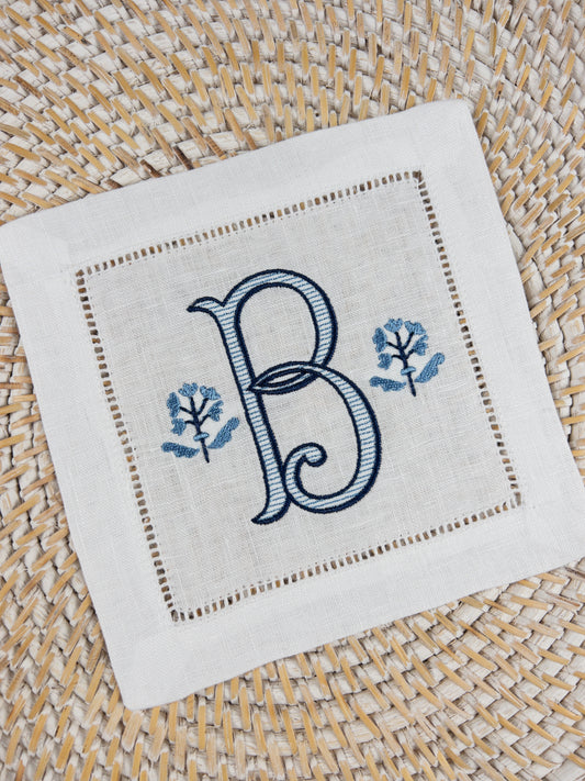 White Linen Cocktail Napkins Monogrammed with a Colonial Style Flower
