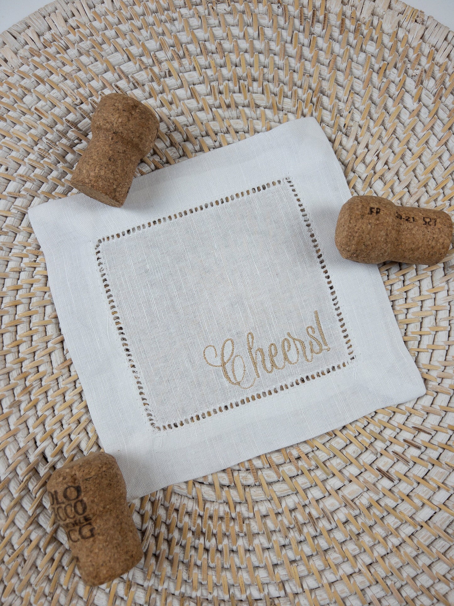 White Linen Cocktail Napkin embroidered with Cheers!